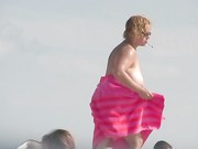 Shameless nudists make fun on the beach
