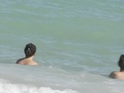 Wives Teasing Nude Beach Voyeurs   Gives One A Handjob!