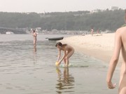 Two young nudist teens  Running at the beach